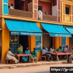 차드에서 프랑스어 사용 비율 - A bustling urban street scene in N&rsquo;Djamena, Chad, showing young adults and professionals engaging in...